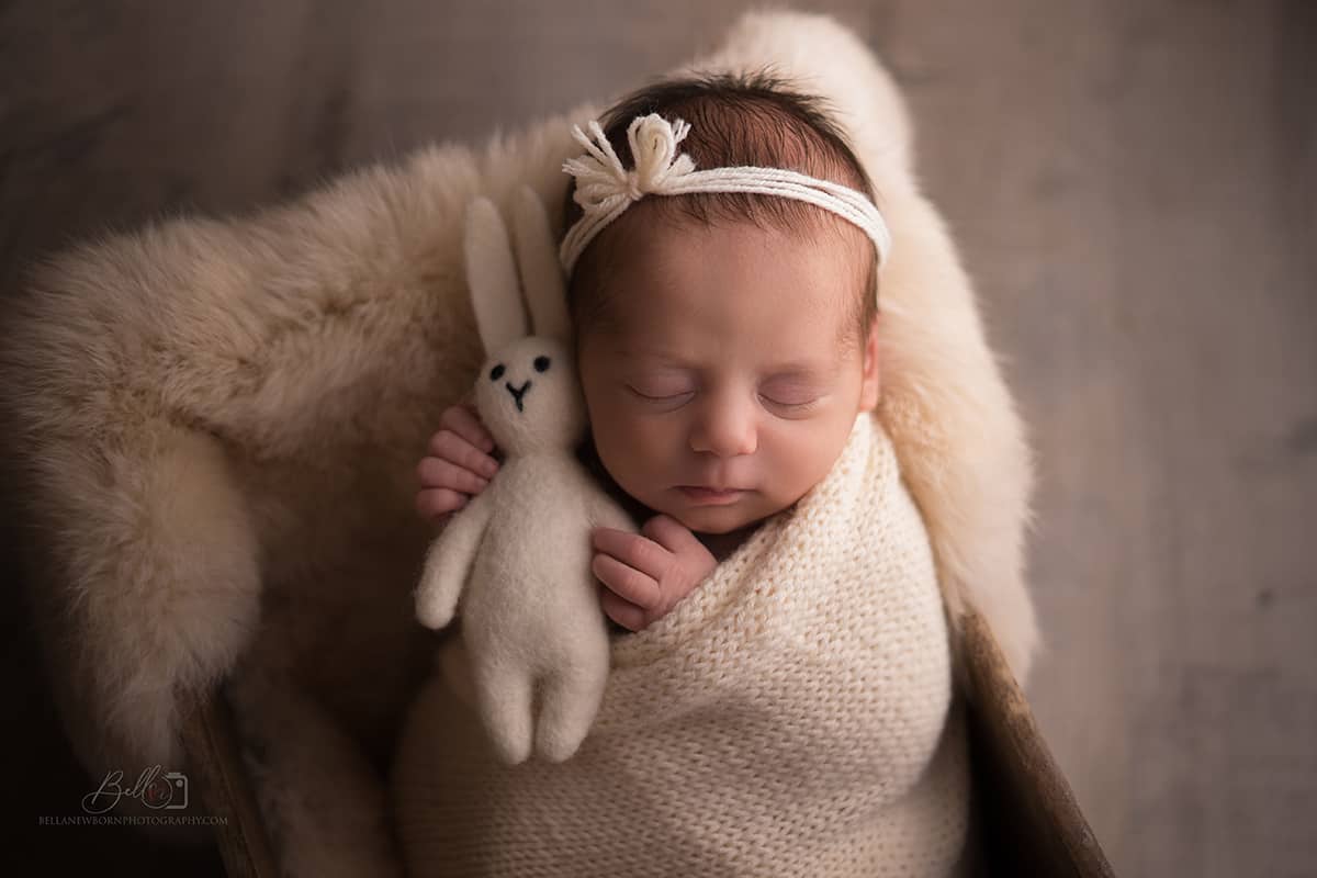 A new-born Baby in a prop with bunny