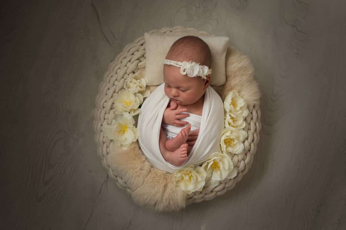 A New-born baby girl inside a beautiful prop